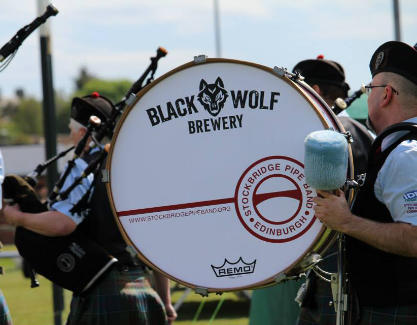 Black Wolf Brewery sponsor logo on the Stockbridge Pipe Band Grade 4 bass drum at Dunbar
